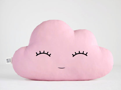 Pink cloud throw pillow, closed eyes and smile; white raindrop pillow – plain white background.